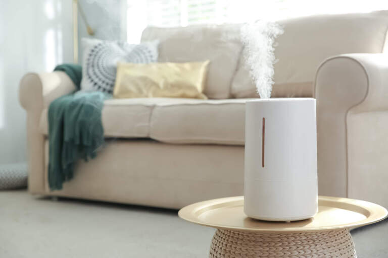 Modern air humidifier on table